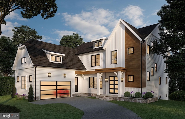 modern farmhouse with a garage and a front yard