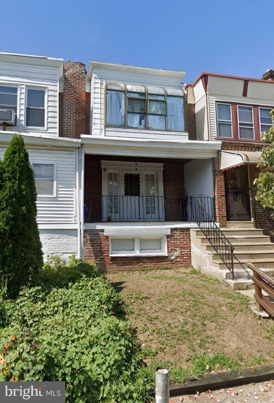 view of property featuring a porch