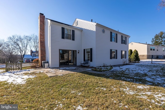 snow covered property featuring a yard