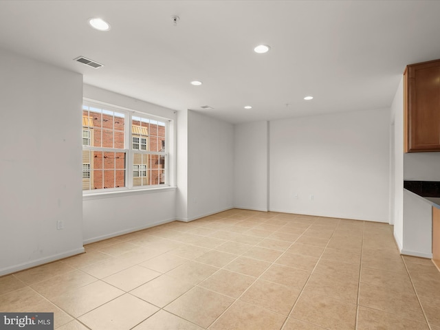 unfurnished room featuring light tile patterned flooring, visible vents, recessed lighting, and baseboards