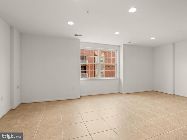 unfurnished room featuring light tile patterned floors, visible vents, recessed lighting, and baseboards