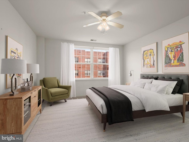 bedroom featuring visible vents and a ceiling fan