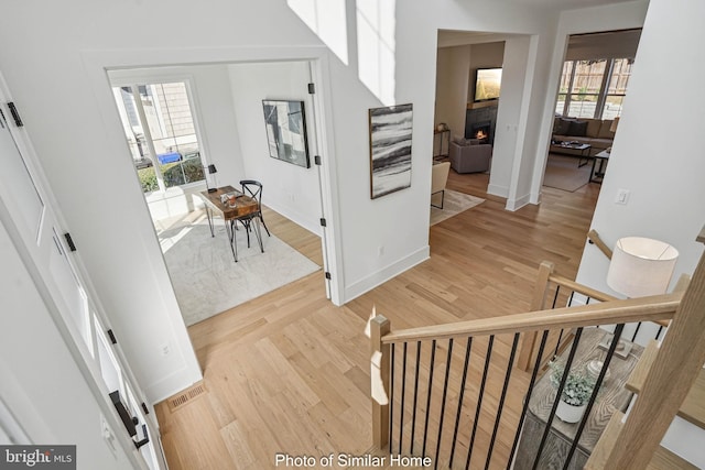 stairs featuring wood-type flooring