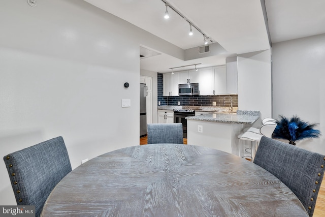 dining area featuring sink