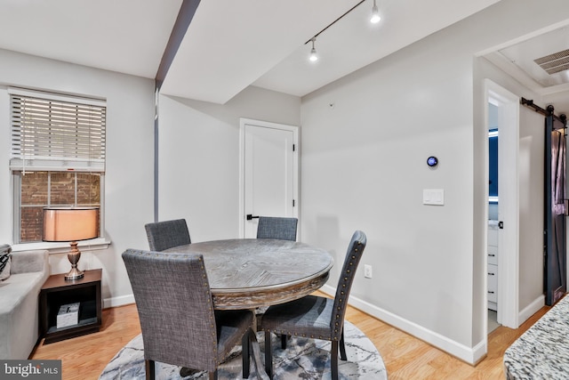 dining room with light wood-type flooring