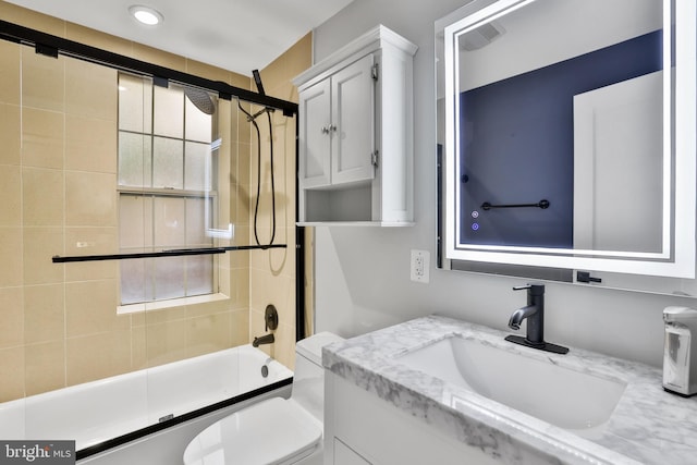 full bathroom with toilet, vanity, and combined bath / shower with glass door