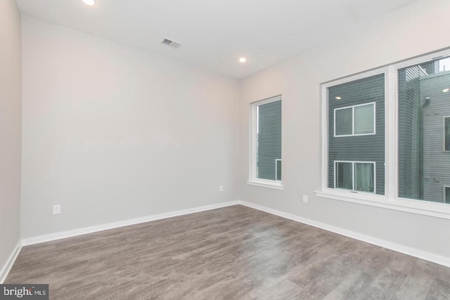 unfurnished room featuring wood-type flooring