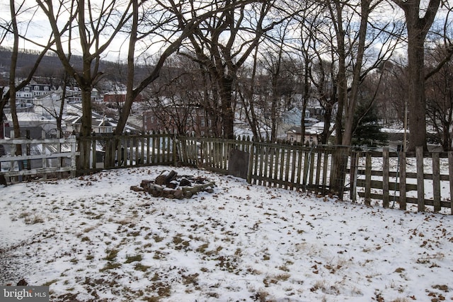 view of yard layered in snow