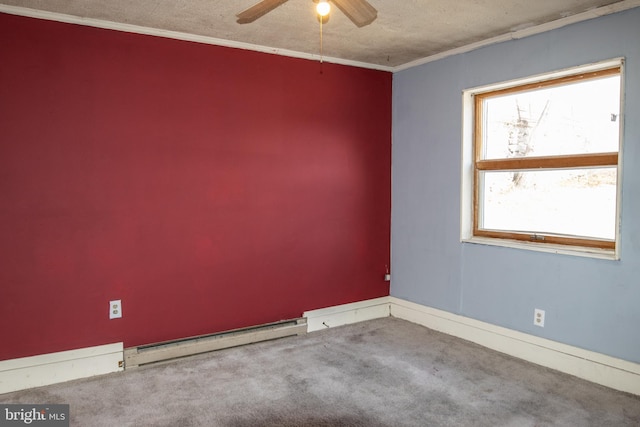 carpeted empty room with ornamental molding, a textured ceiling, ceiling fan, and a baseboard heating unit