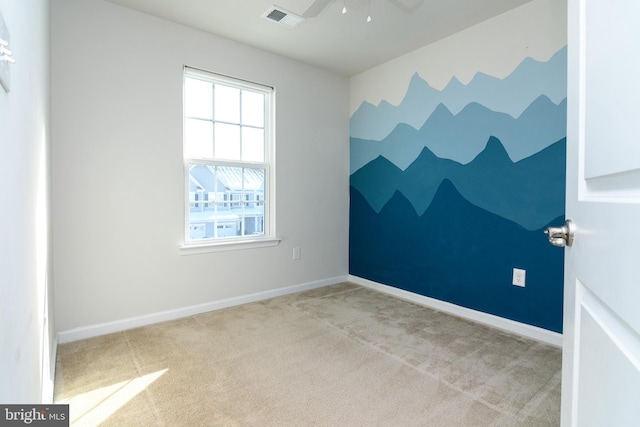 carpeted empty room with ceiling fan