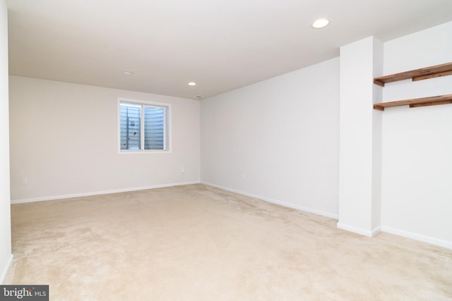 empty room featuring light carpet