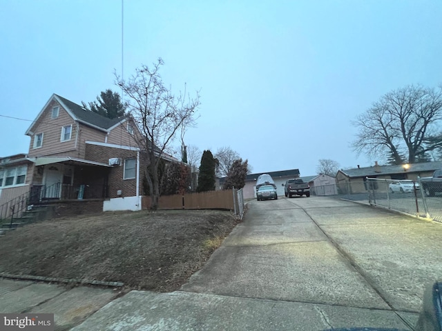 view of side of property with a porch