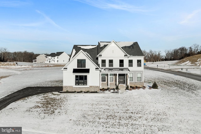 view of snow covered property