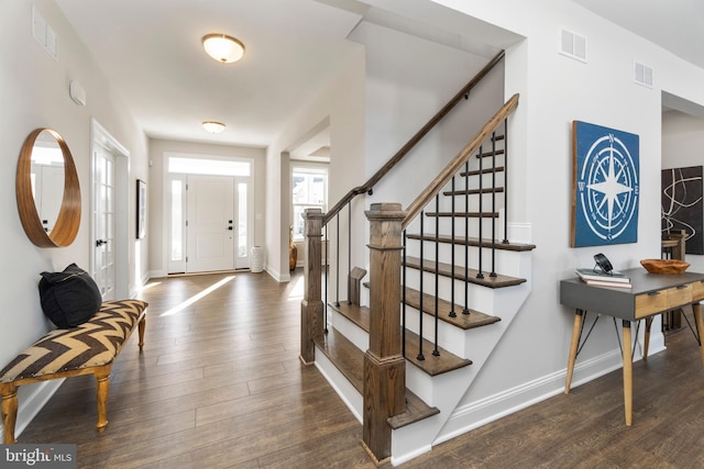 foyer entrance with dark wood-type flooring