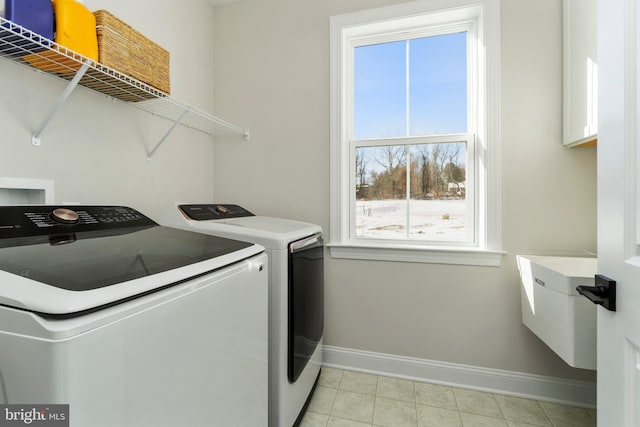 laundry room with independent washer and dryer