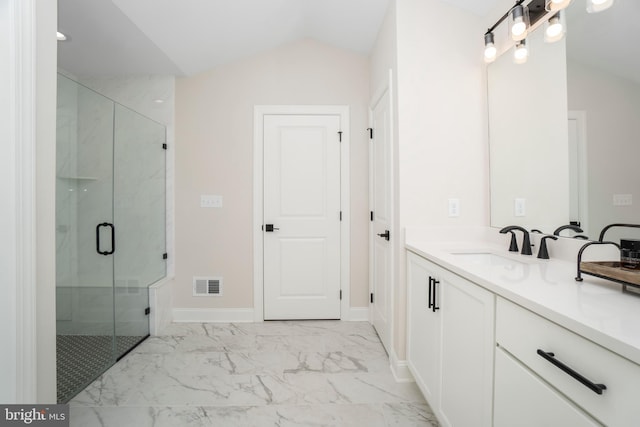 bathroom with vaulted ceiling, vanity, and an enclosed shower