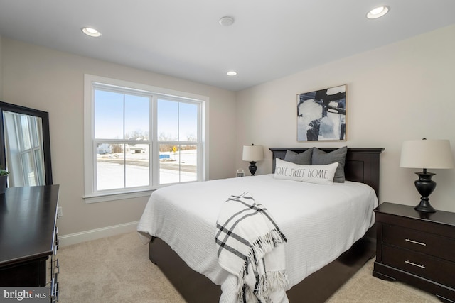 bedroom featuring light carpet