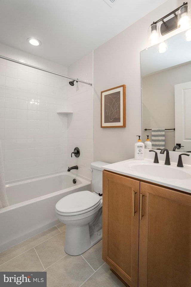 full bathroom featuring toilet, vanity, bathing tub / shower combination, and tile patterned floors