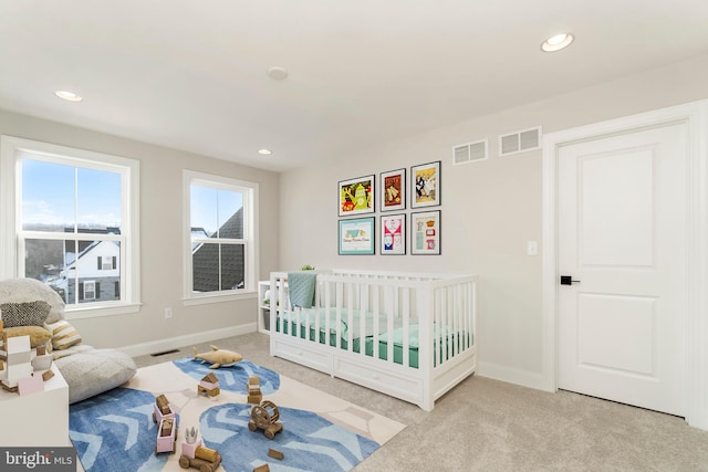 bedroom with light colored carpet