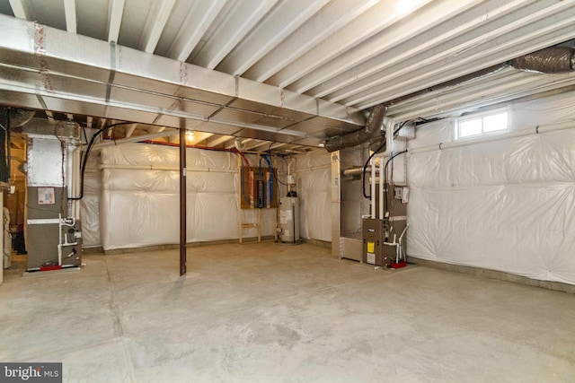 basement with gas water heater and heating unit