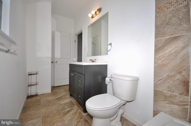 bathroom with toilet and vanity