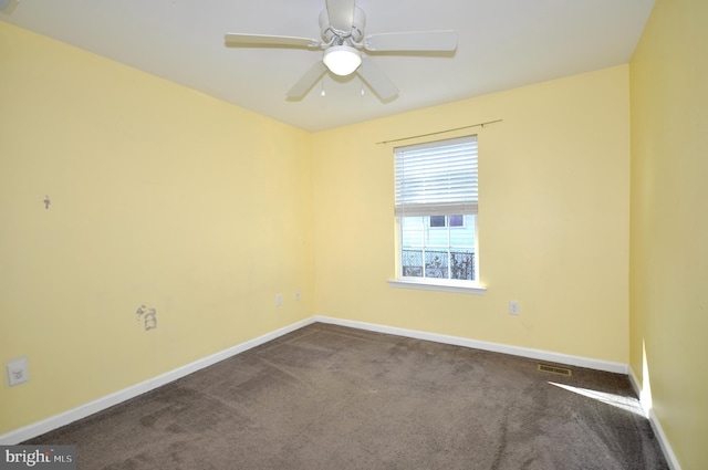 carpeted empty room featuring ceiling fan