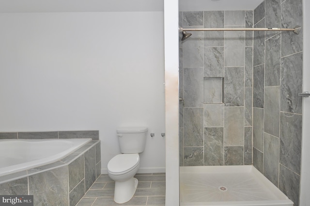 bathroom featuring toilet and shower with separate bathtub