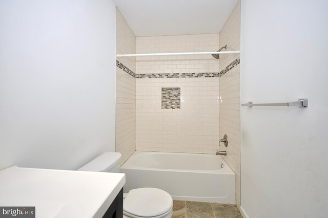 full bathroom with toilet, vanity, and tiled shower / bath combo