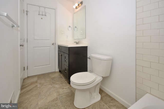 bathroom featuring toilet and vanity