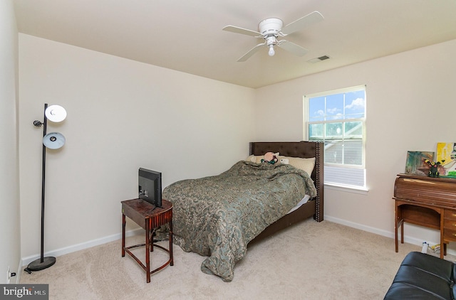 bedroom with a ceiling fan, carpet flooring, visible vents, and baseboards