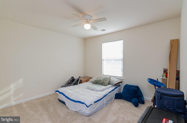 bedroom featuring ceiling fan, carpet, visible vents, and baseboards