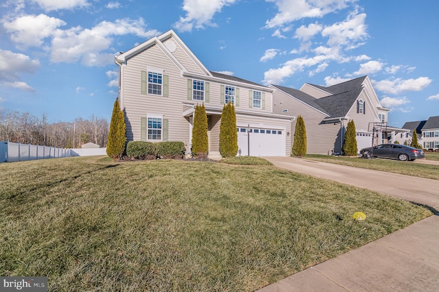 view of front property featuring a garage and a front lawn