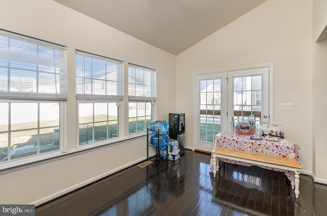 sitting room with baseboards, vaulted ceiling, and dark wood-style flooring