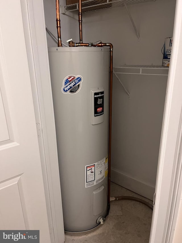 utility room with water heater