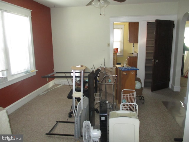 interior space featuring ceiling fan