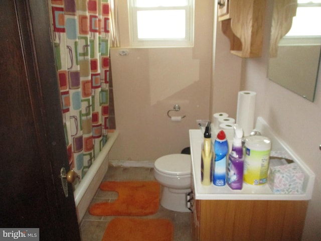 full bathroom with toilet, vanity, tile patterned floors, and shower / bath combination with curtain