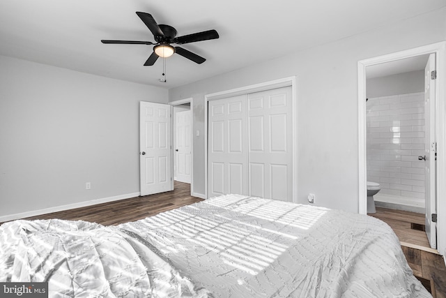 bedroom with connected bathroom, ceiling fan, a closet, and dark wood-type flooring