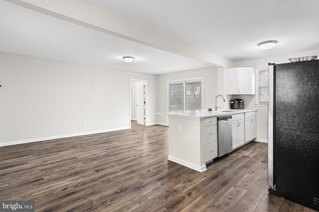 kitchen with dishwasher, refrigerator, sink, dark hardwood / wood-style floors, and white cabinetry