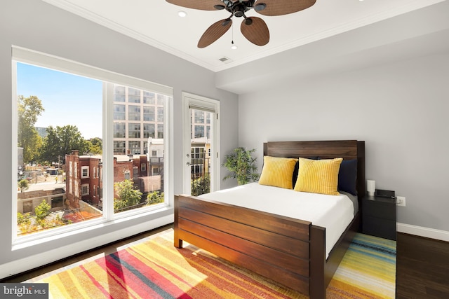 bedroom with crown molding, hardwood / wood-style flooring, access to exterior, and ceiling fan