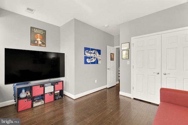 living room with dark hardwood / wood-style floors