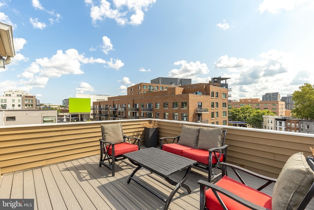 wooden deck featuring outdoor lounge area