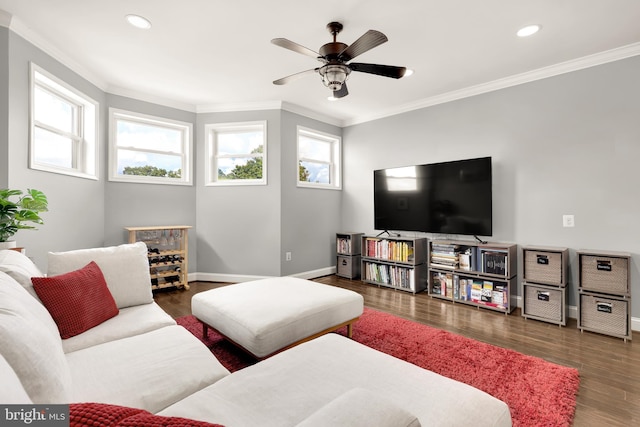 living room featuring crown molding, plenty of natural light, and dark hardwood / wood-style floors