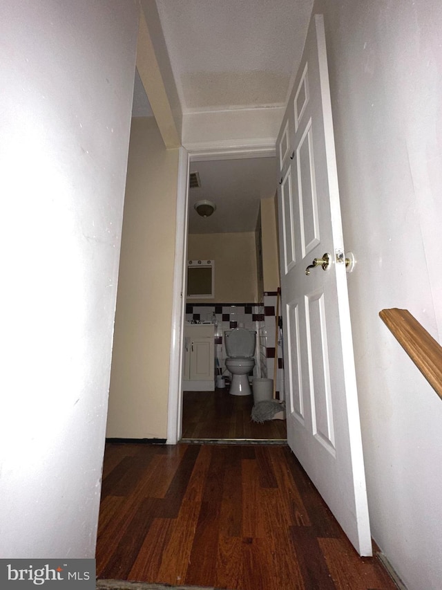 hall with dark hardwood / wood-style floors