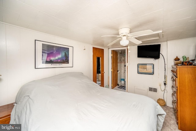 carpeted bedroom featuring ceiling fan and connected bathroom