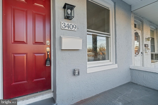 doorway to property with a porch