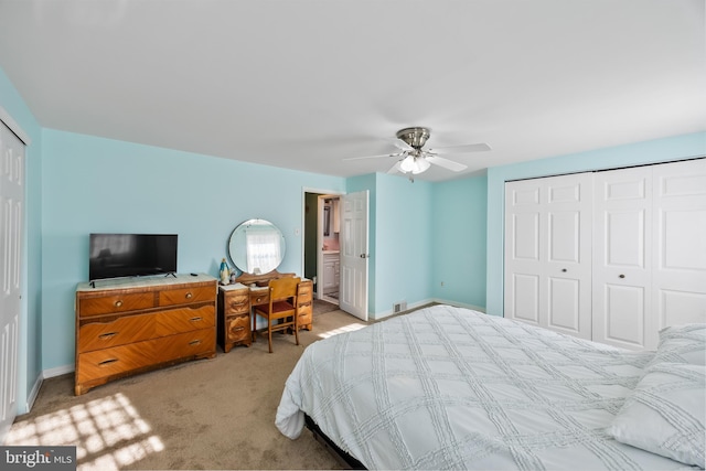 bedroom featuring ceiling fan and light carpet