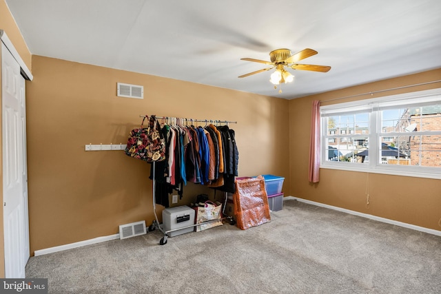 unfurnished bedroom featuring carpet, ceiling fan, and a closet