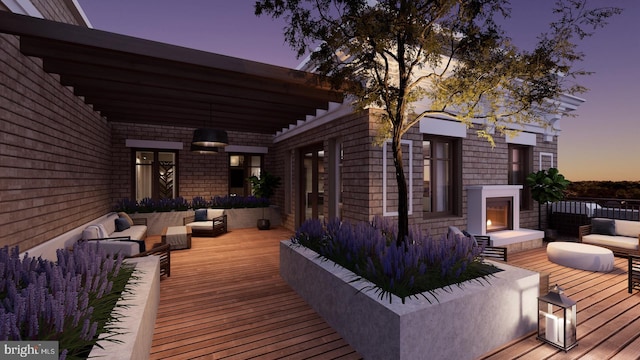 8551 Connecticut Ave Unit 210, Chevy Chase, MD 20815 - deck at dusk with an outdoor living space with a fireplace