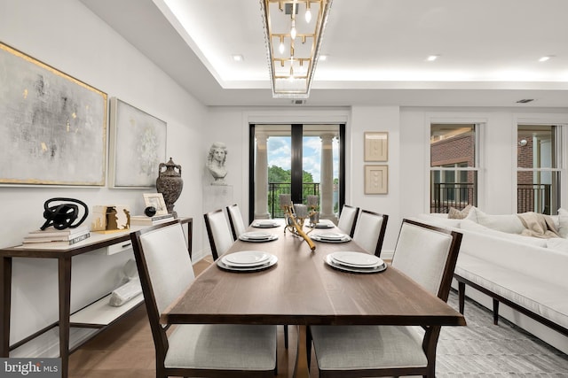 8551 Connecticut Ave Unit 210, Chevy Chase, MD 20815 - dining space with a raised ceiling, french doors, and a chandelier