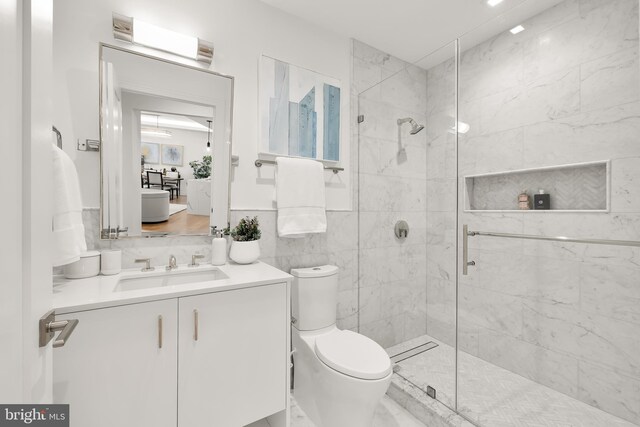 8551 Connecticut Ave Unit 210, Chevy Chase, MD 20815 - bathroom featuring vanity, toilet, and a shower with shower door